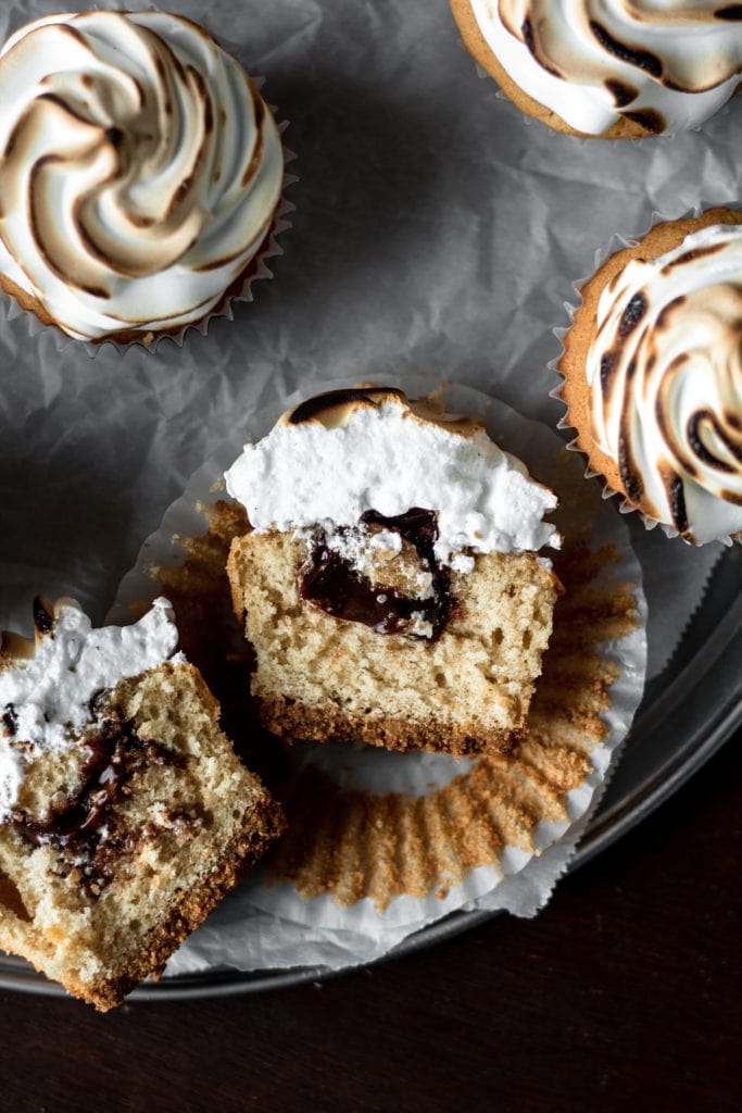 S'mores Cupcakes with graham cracker crust, chocolate ganache & toasted meringue