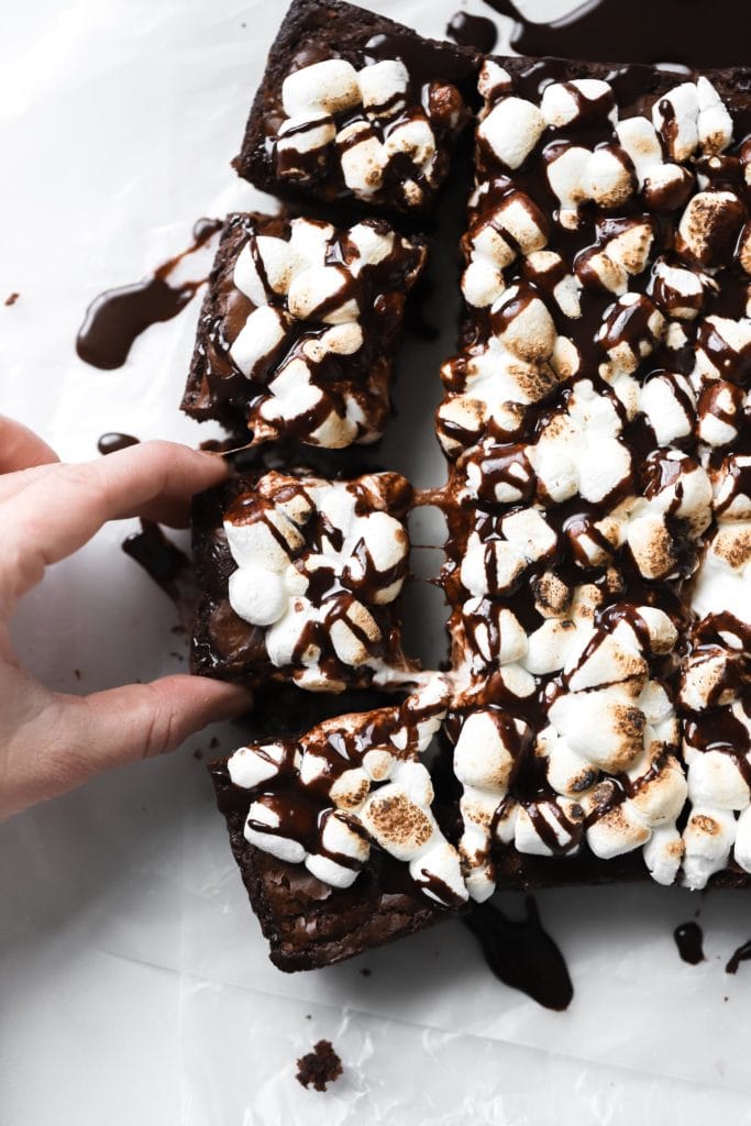 Rich brownies with toasted marshmallows and chocolate drizzle